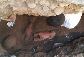 1,700-year-old untouched tomb yields elaborate headdress figurine 